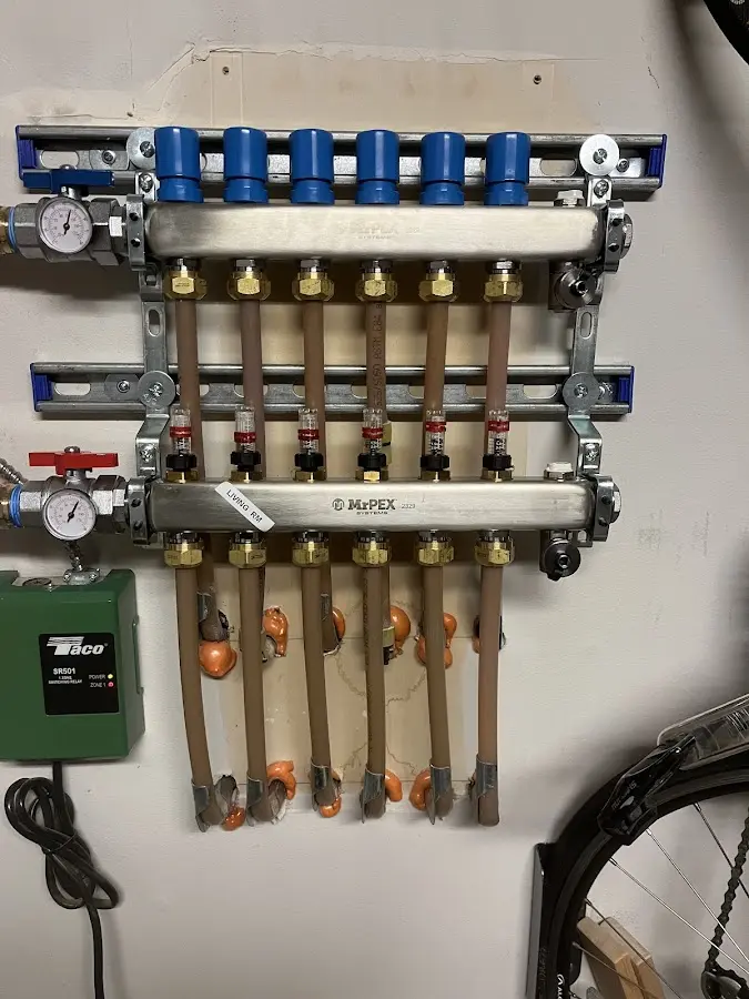 Plumber performing Water Heater Repair at a residential property in Enfield